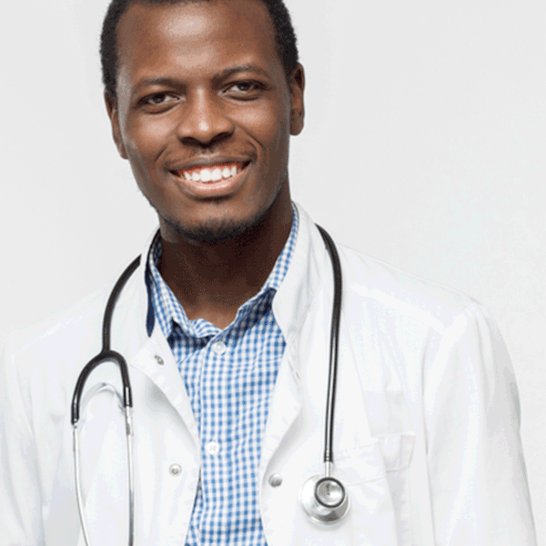 Smiling young male doctor in white coat with stethoscope.